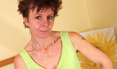 Hairy Mature Slut Masturbating On The Bed