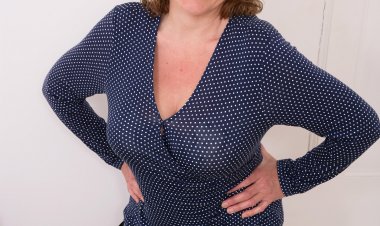 Naughty British housewife showing off her big tits