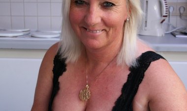 Blonde housewife playing with her pussy in the kitchen