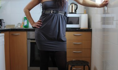 Naughty Spanish housewife playing in her kitchen