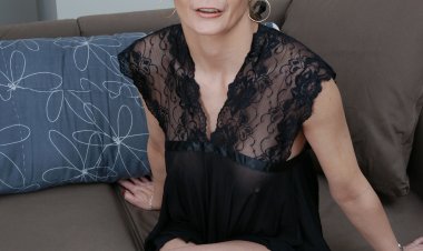 Naughty European housewife playing with herself on the couch