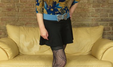 Horny housewife playing with her pussy on the couch