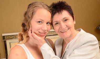 Old and young lesbian couple getting wet