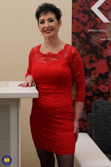 Naughty mature lady playing on her couch with herself