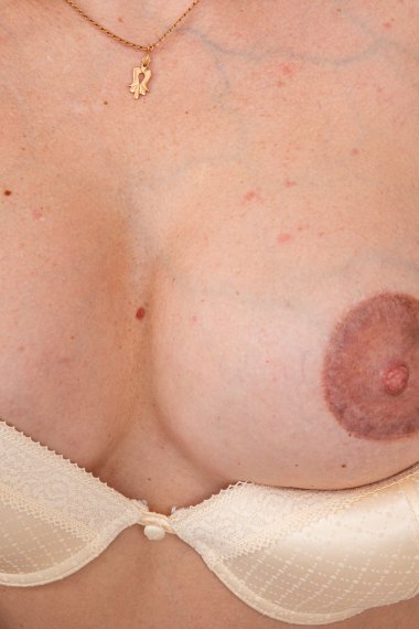 Big nipple MILF playing with her wet pussy