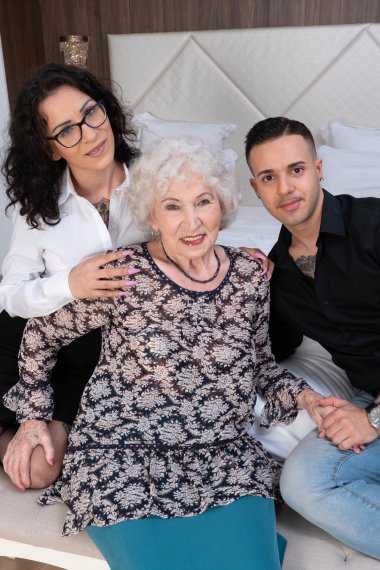 Horny granny gets it in a threesome with a tatooed younger couple