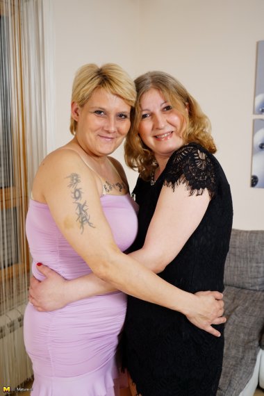 Two curby mature ladies getting wet and wild in the livingroom