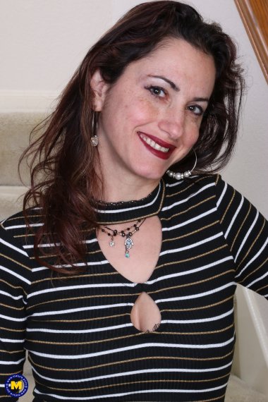 Horny American housewife playing on the staircase