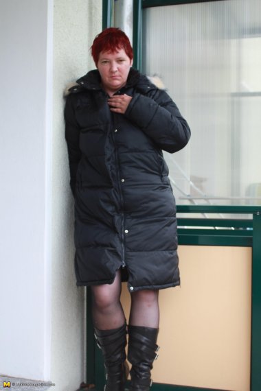 Naughty housewife playing on her balcony