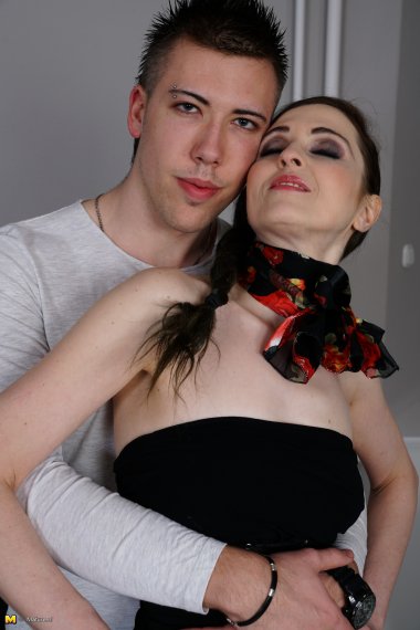 Naughty housewife playing with her toy boy