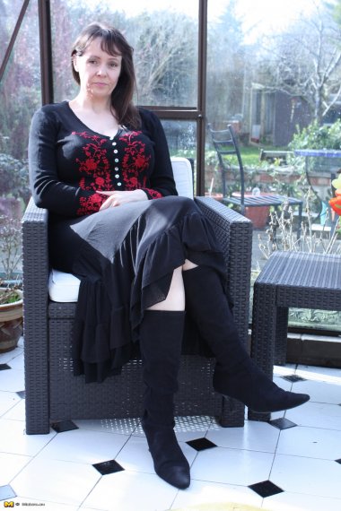 Big breasted British housewife getting wet