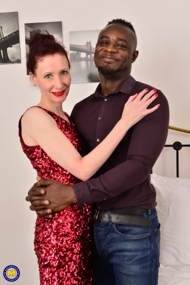 Horny British mature lady munching on a big black cock