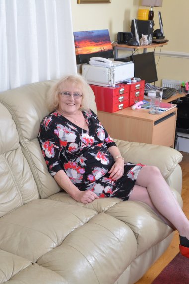 Naughty British mature lady getting wet on her couch