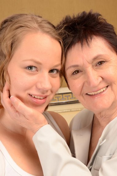 Old and young lesbian couple getting wet