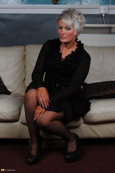 Naughty housewife masturbating on the couch