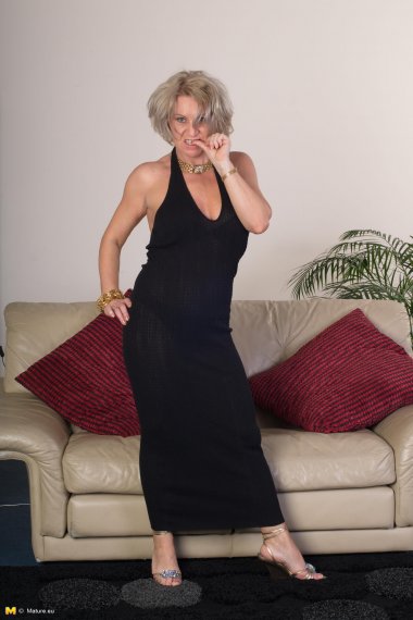 This horny housewife is grinding on her couch