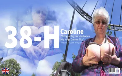 Granny Caroline with a cup size of 38 plays with Her Massive Tits and Talks Dirty in the Garden